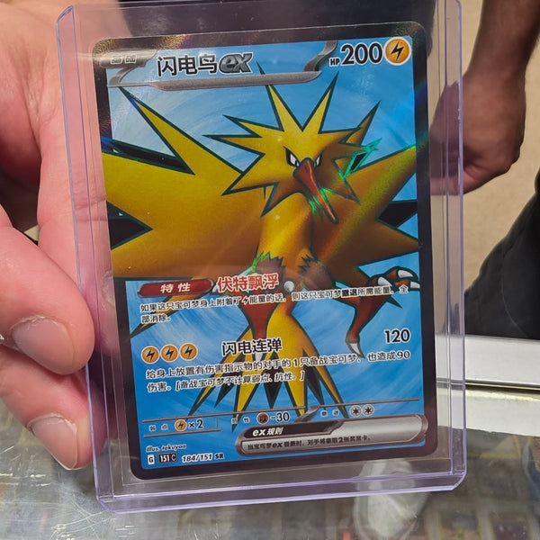 A collector showing off a big pull at Cards2Go