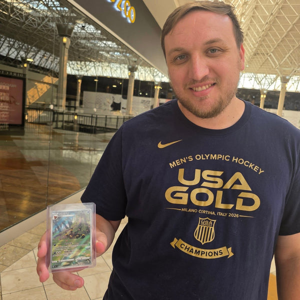 A collector showing off a big pull at Cards2Go Oxford Valley Mall in Langhorne, PA
