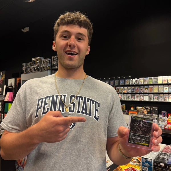 A collector showing off a big pull at Cards2Go Freehold Raceway Mall in Freehold, NJ
