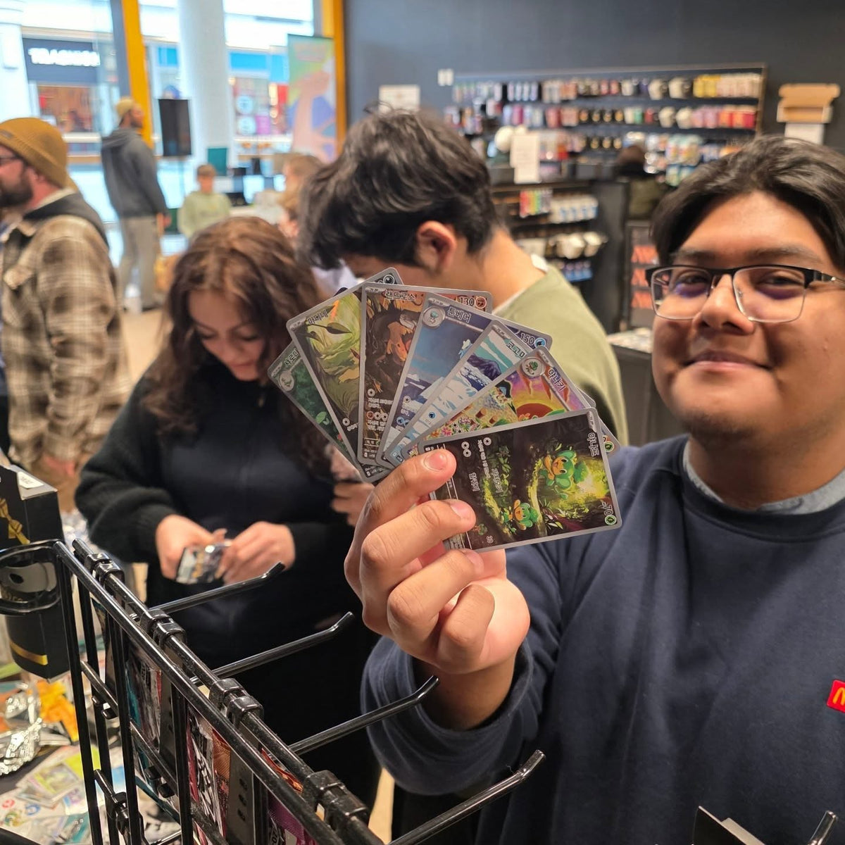 A collector showing off a big pull at Cards2Go