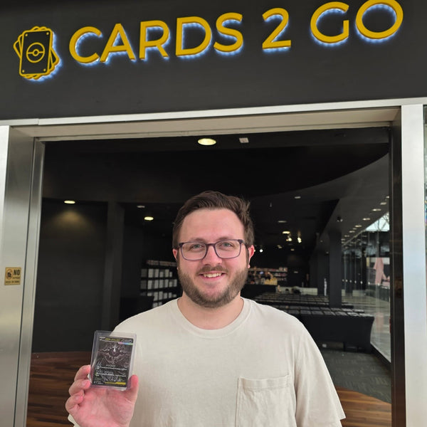 A collector showing off a big pull at Cards2Go